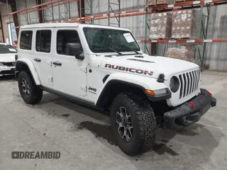 2021 Jeep Wrangler Unlimited Rubicon with VIN 1C4HJXFN2MW809904, listed as a IAAI auction lot 41567956 with 34,000 mi miles and . Bid and sale history available at DreamBid. Image 1.