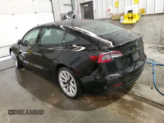 2023 Tesla Model 3 with VIN 5YJ3E1EA8PF451324, listed as a Copart auction lot 88318475 with 74,582 mi miles and Salvage Title. Bid and sale history available at DreamBid. Image 2.