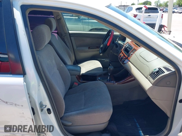 2004 Toyota Camry LE with VIN JTDBE32K840277463, listed as a IAAI auction lot 42080523 with 139,558 mi miles. Bid and sale history available at carsss.com. Image 5.