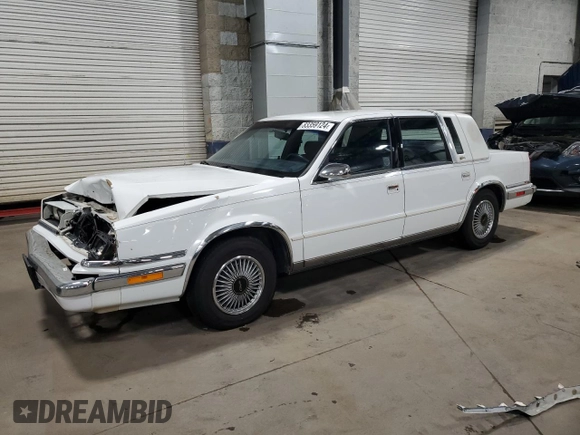 1991 Chrysler New Yorker z VIN 1C3XY66R1MD290977, wystawiony jako Copart lot #83359124 z przebiegiem 98 611 mil mil oraz Szkoda całkowita • Salvage title. Historia ofert i sprzedaży dostępna na DreamBid. Obrazek 1.
