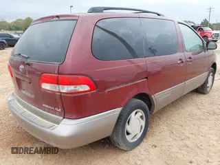 2002 Toyota Sienna LE with VIN 4T3ZF13C12U437425, listed as a IAAI auction lot 41157987 with 200,309 mi miles. Bid and sale history available at carsss.com. Image 4.