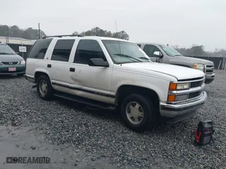 1999 Chevrolet Tahoe with VIN 1GNEC13RXXR101766, listed as a IAAI auction lot 41393447 with 387,448 mi miles. Bid and sale history available at carsss.com. Image 1.