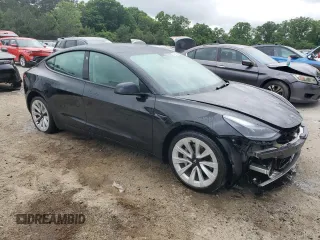 2022 Tesla Model 3 with VIN 5YJ3E1EA0NF372095, listed as a Copart auction lot 54958215 with 148,441 mi miles and Clean Title. Bid and sale history available at DreamBid. Image 4.
