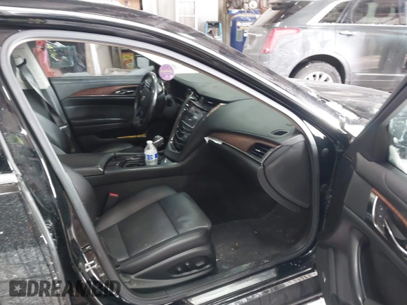 2016 Cadillac CTS Luxury Collection AWD with VIN 1G6AX5SX6G0111768, listed as a IAAI auction lot 41563991 with 76,718 mi miles and . Bid and sale history available at DreamBid. Image 5.