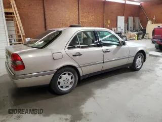 1995 Mercedes-Benz C with VIN WDBHA28E8SF115598, listed as a Copart auction lot 50145195 with 129,134 mi miles and Clean Title. Bid and sale history available at carsss.com. Image 3.