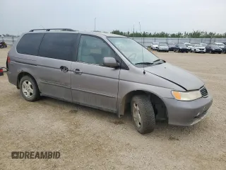 2000 Honda Odyssey EX z VIN 2HKRL186XYH010384, wystawiony jako Copart lot #60871845 z przebiegiem 423 167 mil mil oraz Czysty tytuł • Clean title. Historia ofert i sprzedaży dostępna na DreamBid. Obrazek 4.