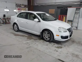 2009 Volkswagen Jetta z VIN 3VWRL81K19M120894, wystawiony jako IAAI lot #41751817 z przebiegiem 146 169 mil mil oraz . Historia ofert i sprzedaży dostępna na DreamBid. Obrazek 1.
