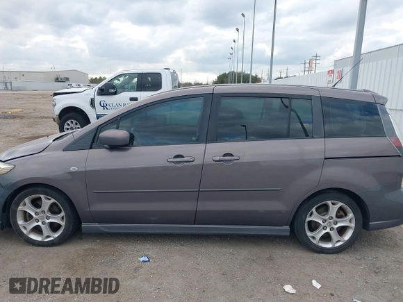 2009 Mazda 5 Sport with VIN JM1CR29L990341261, listed as a IAAI auction lot 41522567 with 123,465 mi miles and . Bid and sale history available at DreamBid. Image 14.