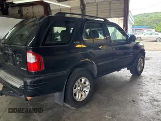 2002 Isuzu Rodeo S with VIN 4S2CK58W124336947, listed as a Copart auction lot 63482935 with 248,008 mi miles and Clean title. Bid and sale history available at DreamBid. Image 4.