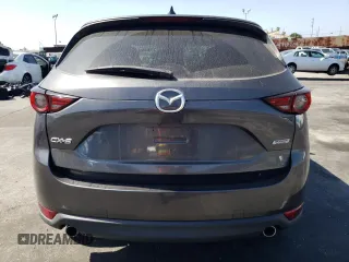 2019 Mazda CX-5 Grand Touring with VIN JM3KFADM6K1641992, listed as a Copart auction lot 57862345 with 37,100 mi miles and Salvage title. Bid and sale history available at DreamBid. Image 6.
