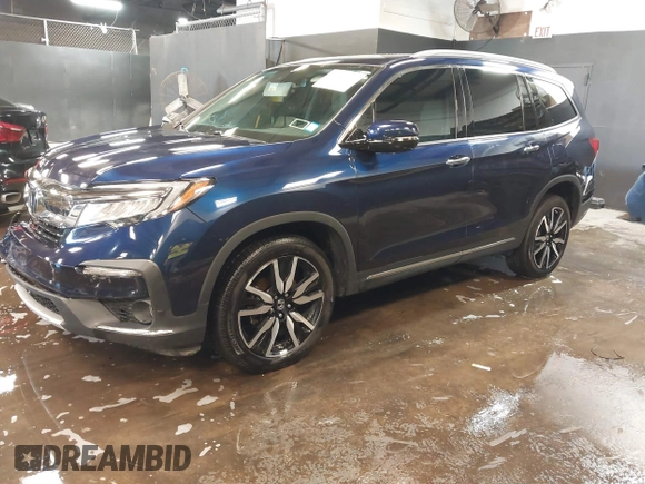 2022 Honda Pilot Touring 7-Passenger with VIN 5FNYF6H65NB052164, listed as a IAAI auction lot 41641601 with 51,700 mi miles. Bid and sale history available at carsss.com. Image 2.