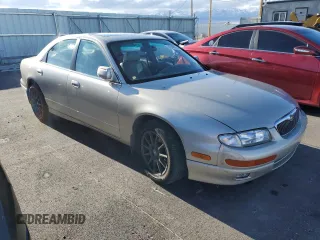 1997 Mazda Millenia S z VIN JM1TA2229V1307575, wystawiony jako Copart lot #87040954 z przebiegiem 160 513 mil mil oraz Szkody całkowita. Historia ofert i sprzedaży dostępna na DreamBid. Obrazek 4.