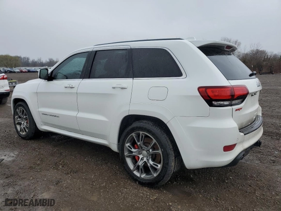 2015 Jeep Grand Cherokee SRT with VIN 1C4RJFDJ6FC941941, listed as a Copart auction lot 50613315 with 173,992 mi miles and Salvage Title. Bid and sale history available at carsss.com. Image 2.