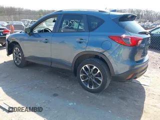 2016 Mazda CX-5 Grand Touring z VIN JM3KE4DY6G0785255, wystawiony jako IAAI lot #41887066 z przebiegiem 171 334 mil mil oraz . Historia ofert i sprzedaży dostępna na DreamBid. Obrazek 3.