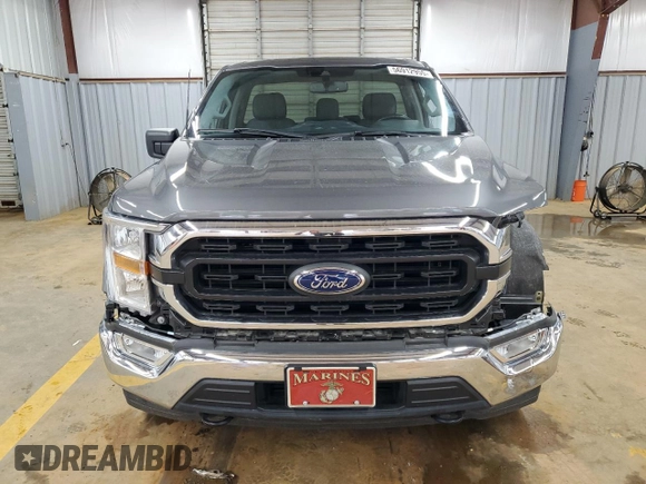 2021 Ford F-150 XL with VIN 1FTMF1EP7MKE58611, listed as a Copart auction lot 56912955 with 30,850 mi miles and Salvage title. Bid and sale history available at DreamBid. Image 5.