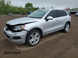 2014 Volkswagen Touareg Sport с VIN WVGEF9BP0ED014429, выставлен на аукционе Copart как лот 58692875 с пробегом 157 417 миль миль и Списание • Salvage title. История ставок и продаж доступна на DreamBid. Изображение 1.