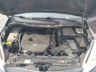 2012 Mazda 5 Sport with VIN JM1CW2BL6C0134921, listed as a IAAI auction lot 42290476 with 128,490 mi miles and . Bid and sale history available at DreamBid. Image 10.