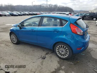 2015 Ford Fiesta Titanium z VIN 3FADP4FJ7FM120958, wystawiony jako Copart lot #85260204 z przebiegiem 144 587 mil mil oraz Szkoda całkowita • Salvage title. Historia ofert i sprzedaży dostępna na DreamBid. Obrazek 2.