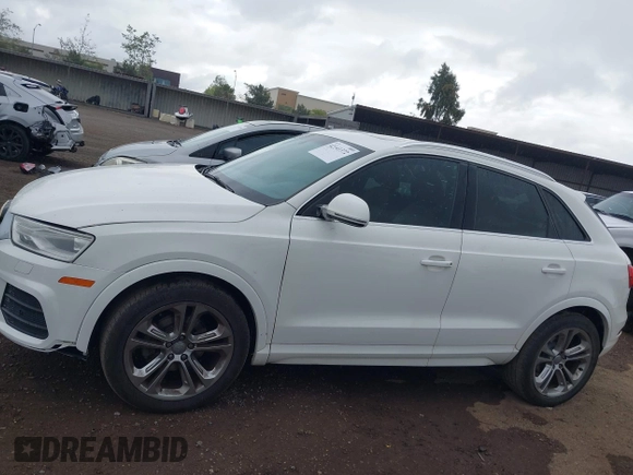 2016 Audi Q3 Premium Plus with VIN WA1BFCFS0GR009654, listed as a IAAI auction lot 42141372 with 138,992 mi miles. Bid and sale history available at carsss.com. Image 14.