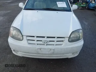 2004 Hyundai Accent GL with VIN KMHCG35C74U303431, listed as a IAAI auction lot 41725717 with 211,893 mi miles. Bid and sale history available at carsss.com. Image 6.