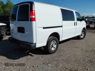 2019 Chevrolet Express Cargo Van with VIN 1GCWGAFP6K1173549, listed as a IAAI auction lot 42082743 with 86,763 mi miles. Bid and sale history available at carsss.com. Image 4.