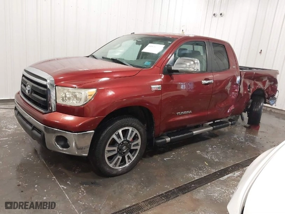 2010 Toyota Tundra 4WD Truck with VIN 5TFUW5F16AX113067, listed as a IAAI auction lot 41826361 with 128,279 mi miles. Bid and sale history available at carsss.com. Image 2.