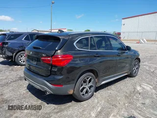 2016 BMW X1 xDrive28i with VIN WBXHT3C3XGP889833, listed as a IAAI auction lot 39118131 with 111,343 mi miles. Bid and sale history available at carsss.com. Image 4.
