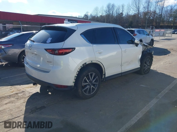 2018 Mazda CX-5 Grand Touring with VIN JM3KFBDM6J0435579, listed as a IAAI auction lot 41208899 with 131,212 mi miles. Bid and sale history available at carsss.com. Image 4.