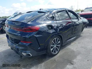 2024 BMW X6 xDrive40i with VIN 5UX33EX07R9V74903, listed as a IAAI auction lot 42063171 with 22,384 mi miles. Bid and sale history available at carsss.com. Image 4.