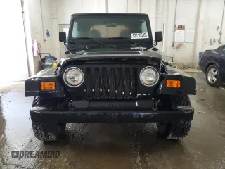 1997 Jeep Wrangler Sport with VIN 1J4FY19S6VP457417, listed as a Copart auction lot 52110535 with 106,129 mi miles and Salvage Title. Bid and sale history available at carsss.com. Image 5.