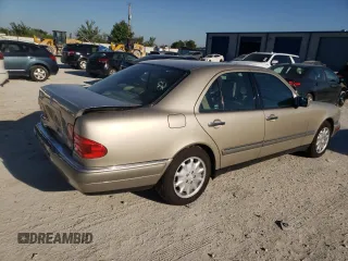 1996 Mercedes-Benz E-Class with VIN WDBJF55F7TJ022765, listed as a Copart auction lot 70577504 with 186,340 mi miles and Salvage Title. Bid and sale history available at carsss.com. Image 3.