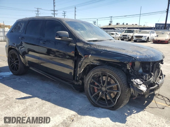 2018 Jeep Grand Cherokee Trackhawk z VIN 1C4RJFN90JC293820, wystawiony jako Copart lot #63778505 z przebiegiem 87 682 mil mil oraz Szkoda całkowita • Salvage title. Historia ofert i sprzedaży dostępna na DreamBid. Obrazek 4.