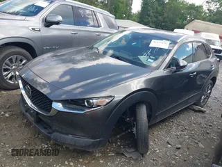 2023 Mazda CX-30 S Premium with VIN 3MVDMBDM2PM526974, listed as a IAAI auction lot 42155416 with 22,428 mi miles and . Bid and sale history available at carsss.com. Image 2.