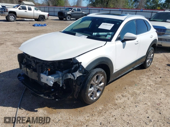2022 Mazda CX-30 S Premium with VIN 3MVDMBDL1NM413540, listed as a IAAI auction lot 41681191 with 57,764 mi miles and . Bid and sale history available at carsss.com. Image 2.