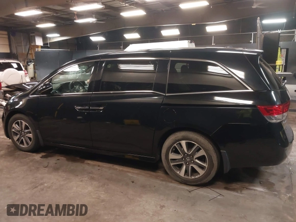 2014 Honda Odyssey Touring with VIN 5FNRL5H94EB105745, listed as a IAAI auction lot 41744012 with 77,032 mi miles and . Bid and sale history available at DreamBid. Image 14.