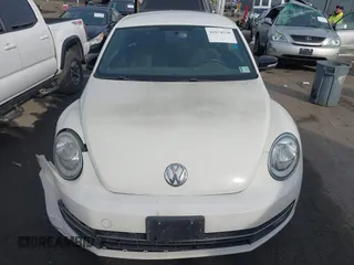 2012 Volkswagen Beetle 2.0T Turbo w/Sun/Snd/Nav PZEV with VIN 3VWVA7ATXCM620731, listed as a IAAI auction lot 41074530 with 99,236 mi miles. Bid and sale history available at carsss.com. Image 12.