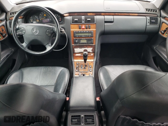 2002 Mercedes-Benz E-Class with VIN WDBJF65J42B486633, listed as a Copart auction lot 76979054 with 151,429 mi miles and Salvage Title. Bid and sale history available at carsss.com. Image 8.
