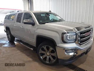 2018 GMC Sierra 1500 SLT with VIN 1GTV2NEC3JZ125233, listed as a IAAI auction lot 40331221 with 74,148 mi miles and . Bid and sale history available at DreamBid. Image 1.