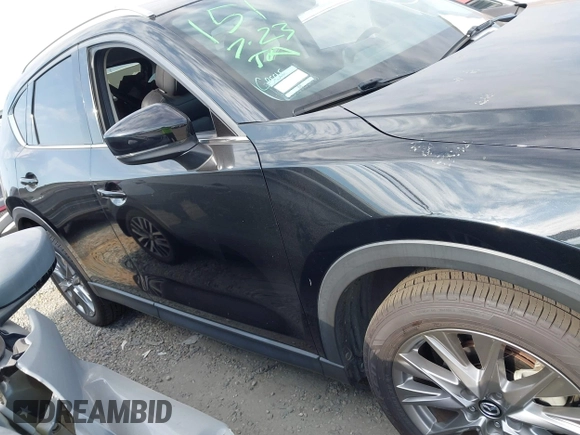2020 Mazda CX-5 Grand Touring with VIN JM3KFADM3L1819939, listed as a IAAI auction lot 42749920 with 35,407 mi miles and . Bid and sale history available at DreamBid. Image 14.