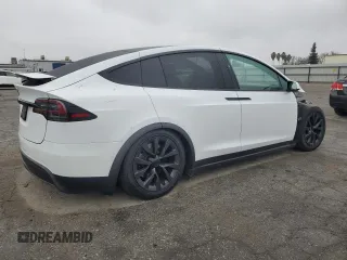 2023 Tesla Model X with VIN 7SAXCAE58PF379943, listed as a Copart auction lot 86352354 with Not Provided miles and Salvage Title. Bid and sale history available at DreamBid. Image 3.