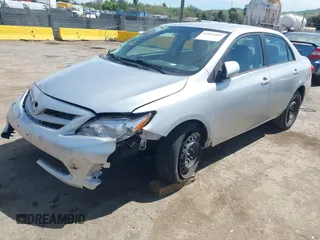 2011 Toyota Corolla L with VIN 2T1BU4EE1BC572731, listed as a IAAI auction lot 42024851 with 153,923 mi miles. Bid and sale history available at carsss.com. Image 2.