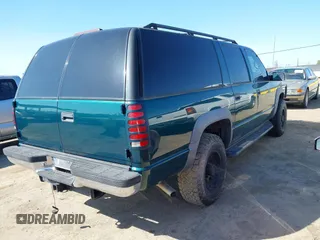1999 GMC Suburban with VIN 3GKGK26J4XG508566, listed as a IAAI auction lot 41778760 with 1,028,244 mi miles. Bid and sale history available at carsss.com. Image 4.