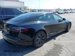 2022 Tesla Model S with VIN 5YJSA1E5XNF467435, listed as a IAAI auction lot 42538706 with 26,504 mi miles and . Bid and sale history available at DreamBid. Image 4.