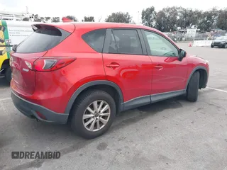 2016 Mazda CX-5 Touring with VIN JM3KE2CY3G0877185, listed as a IAAI auction lot 41729243 with 144,656 mi miles. Bid and sale history available at carsss.com. Image 4.