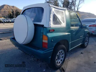 1995 Suzuki Sidekick z VIN 2S3TA02C3S6414337, wystawiony jako Copart lot #86304134 z przebiegiem 104 889 mil mil oraz Szkody całkowita. Historia ofert i sprzedaży dostępna na DreamBid. Obrazek 3.