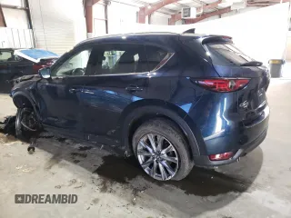 2021 Mazda CX-5 Grand Touring with VIN JM3KFBDM3M0327635, listed as a Copart auction lot 49980635 with 47,160 mi miles and Salvage Title. Bid and sale history available at carsss.com. Image 2.