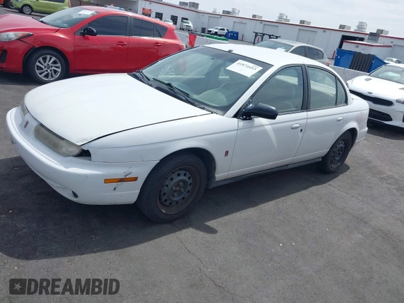 1998 Saturn SL z VIN 1G8ZJ5272WZ312413, wystawiony jako IAAI lot #41874493 z przebiegiem 229 200 mil mil oraz . Historia ofert i sprzedaży dostępna na DreamBid. Obrazek 12.