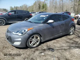2013 Hyundai Veloster w/Gray Int z VIN KMHTC6ADXDU145484, wystawiony jako Copart lot #54921565 z przebiegiem 266 514 mil mil oraz Czysty tytuł • Clean title. Historia ofert i sprzedaży dostępna na DreamBid. Obrazek 1.