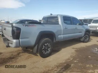 2021 Toyota Tacoma SR5 with VIN 3TMDZ5BN9MM099515, listed as a Copart auction lot 56687385 with 66,721 mi miles and Salvage title. Bid and sale history available at DreamBid. Image 3.