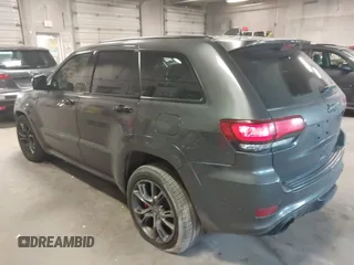 2018 Jeep Grand Cherokee SRT z VIN 1C4RJFDJ6JC432683, wystawiony jako IAAI lot #41971436 z przebiegiem 113 078 mil mil oraz . Historia ofert i sprzedaży dostępna na DreamBid. Obrazek 3.